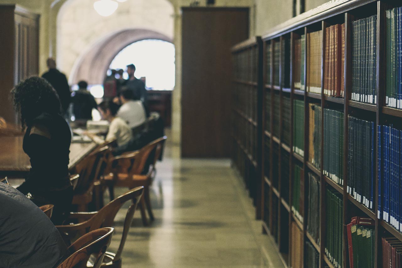 Library with students studying for exams