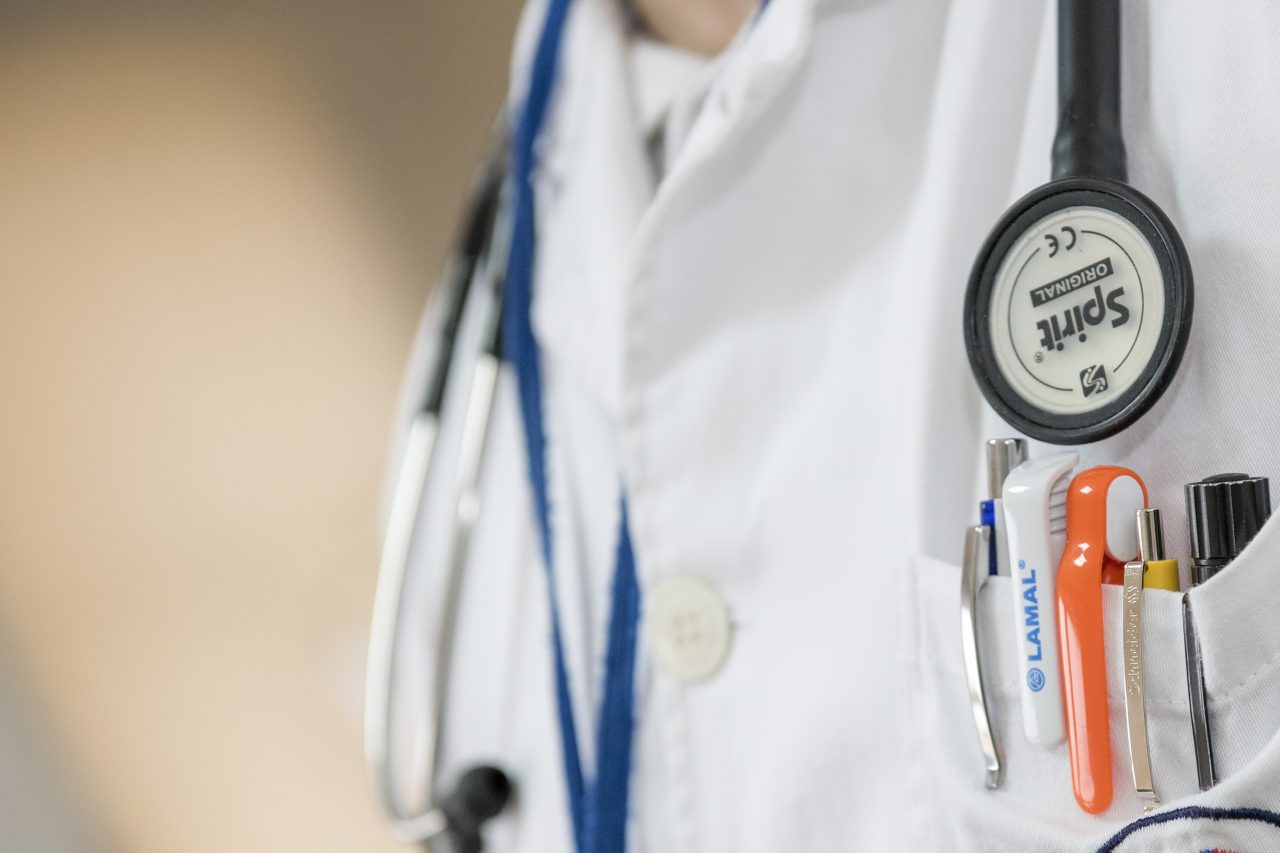 white coat and stethoscope close up