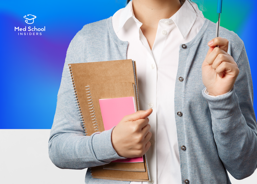 close up body holding notebooks - Choose premed major