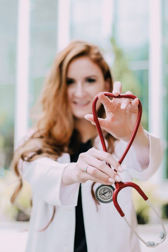 med student with white coat and stethescope