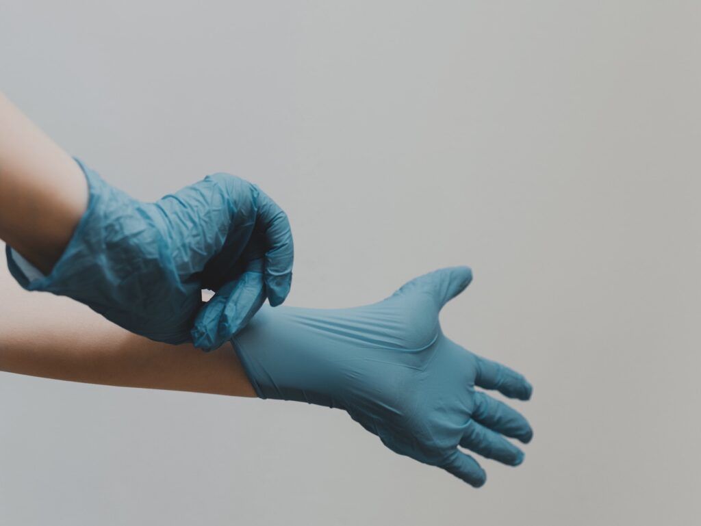 Hands in rubber gloves medical