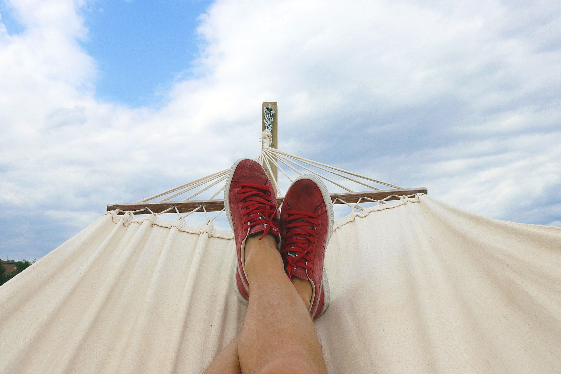 Student laying in a hammock.