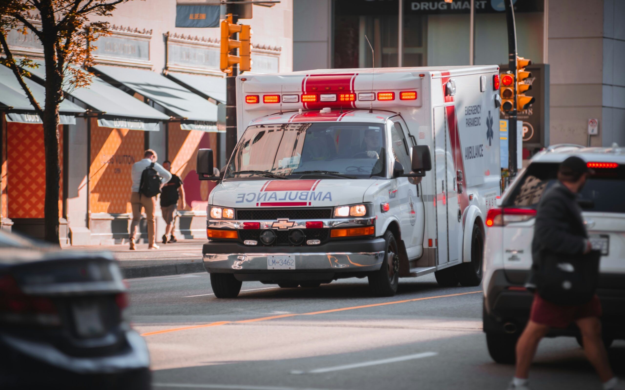 Ambulance rushing by a street