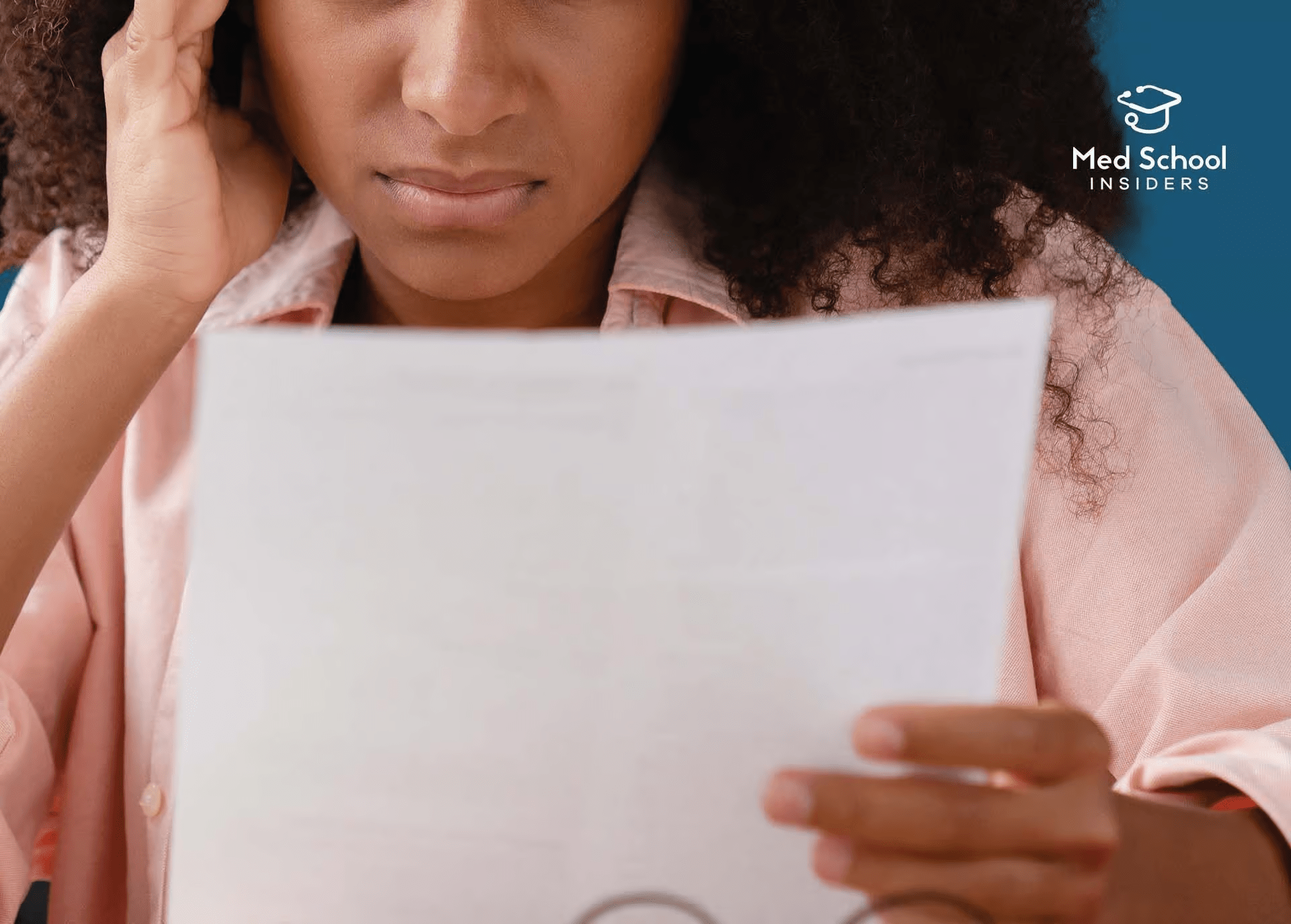 Student looking disappointed while reviewing a poorly written personal statement
