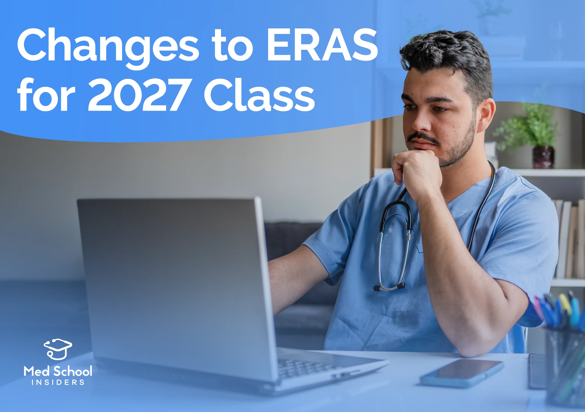 Medical resident in blue scrubs reviewing information on a laptop, representing changes to ERAS for the 2027 residency application cycle.