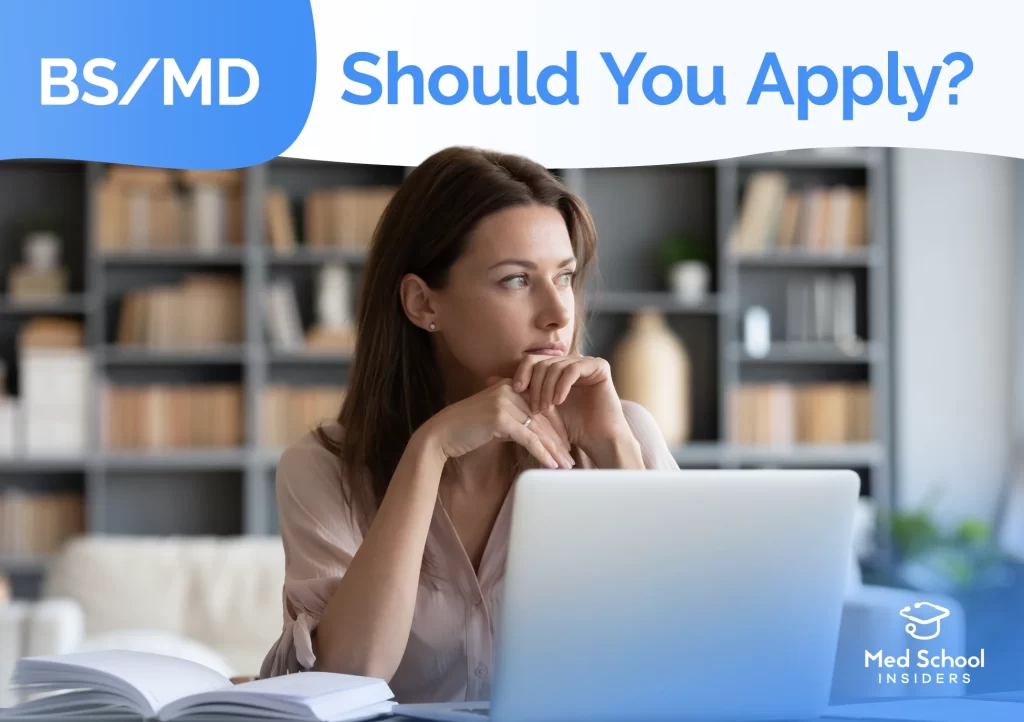 Student thinking while using a laptop, representing the decision of whether to apply to BS/MD programs.