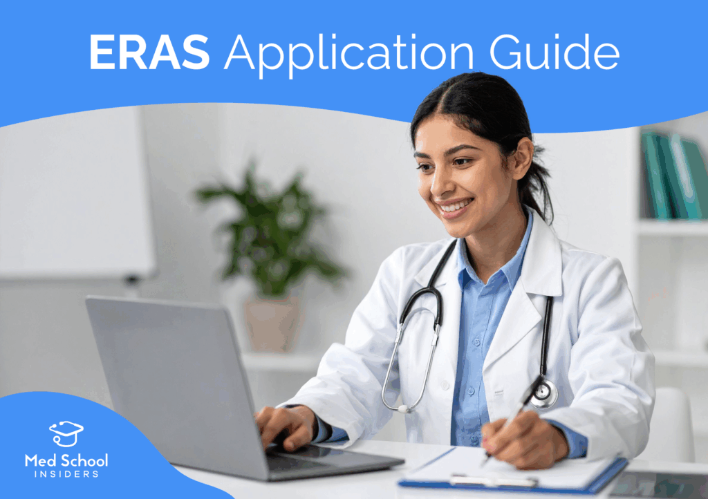 Medical student in a white coat using a laptop and taking notes while preparing a residency application through ERAS.