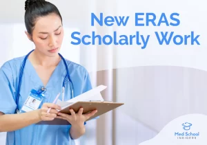 A medical resident in scrubs writing on a clipboard, representing new ERAS scholarly work requirements for 2027.